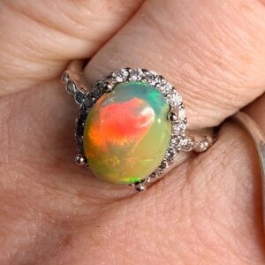 2.2 carat Ethiopian opal adjustable ring green base green orange flash
